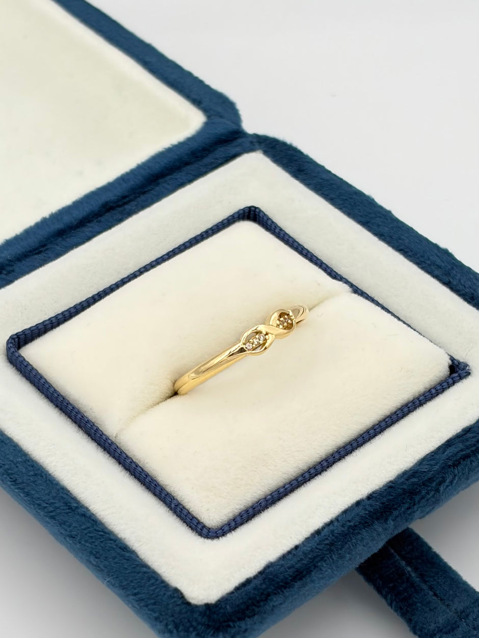 Anillo Infinito circones  Oro amarillo 18k / Talla 8 / 1,20 Gr