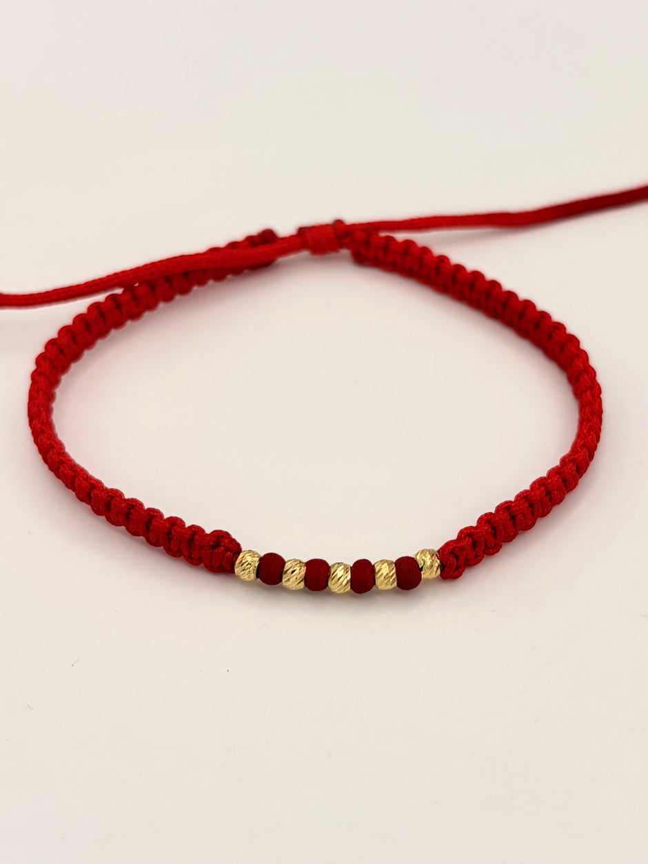 Pulsera tejida 5BD #3 balines de neopreno rojos hilo rojo Oro amarillo 18k 0,20 Gr