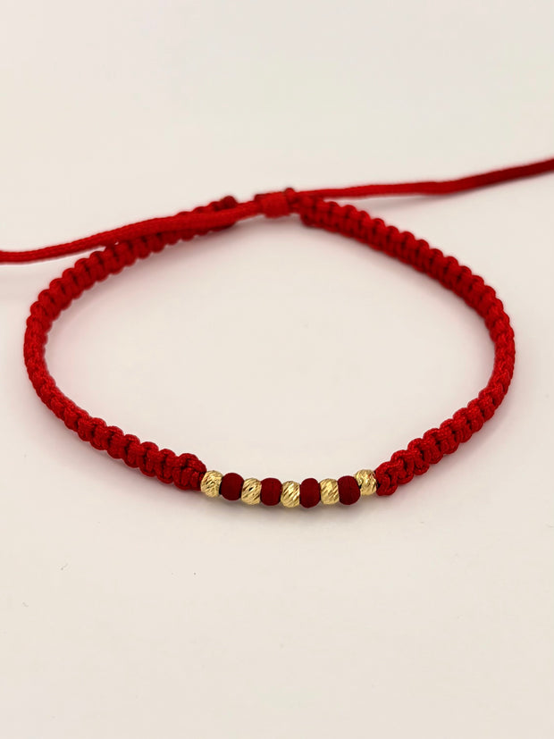 Pulsera tejida 5BD #3 balines de neopreno rojos hilo rojo Oro amarillo 18k 0,20 Gr