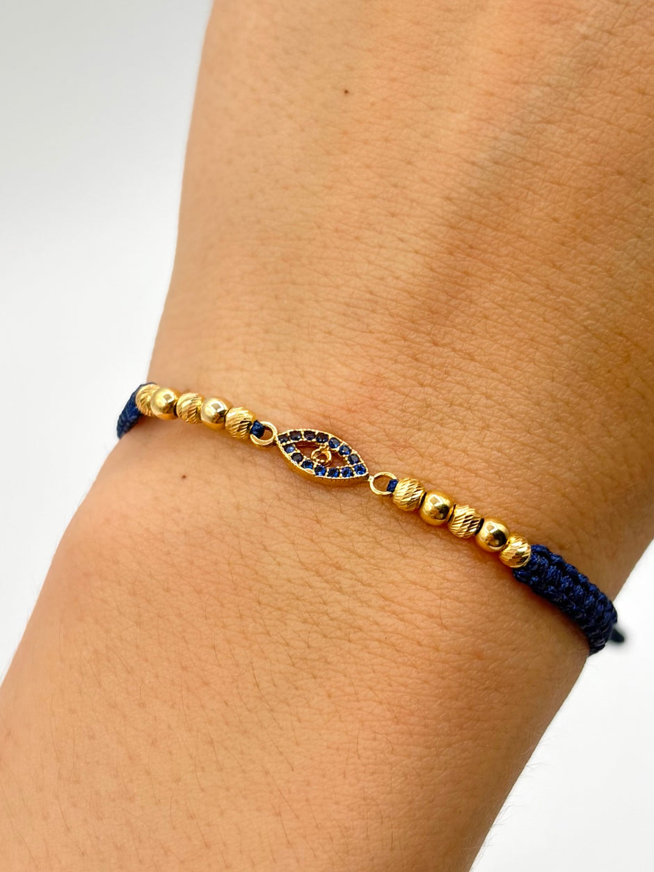 Pulsera tejida herraje ojo circones azules 6BD #3 4BL #3 hilo azul Oro amarillo 18k 1,60 Gr