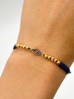 Pulsera tejida herraje ojo circones azules 6BD #3 4BL #3 hilo azul Oro amarillo 18k 1,60 Gr