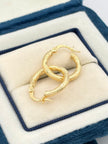 Candonga Semi diamantada  Oro amarillo 18k 1,65 Gr / 1,5 Cm