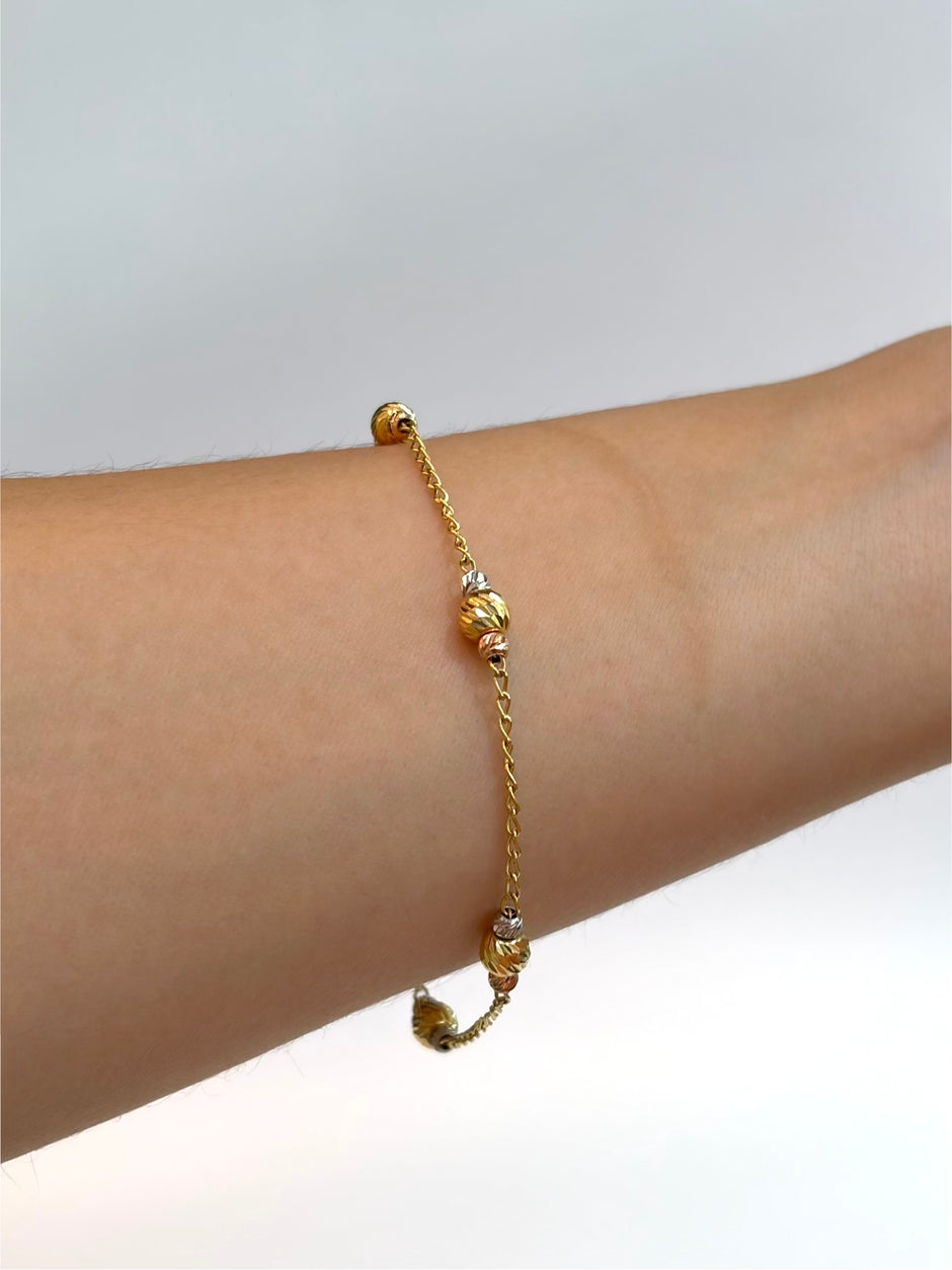 Pulso aro seguido balines diamantados  Tres oros 18k 2,60 Gr / 1,5 mm / 19 Cm Broche 0,15