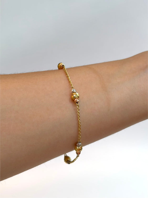 Pulso aro seguido balines diamantados  Tres oros 18k 2,60 Gr / 1,5 mm / 19 Cm Broche 0,15