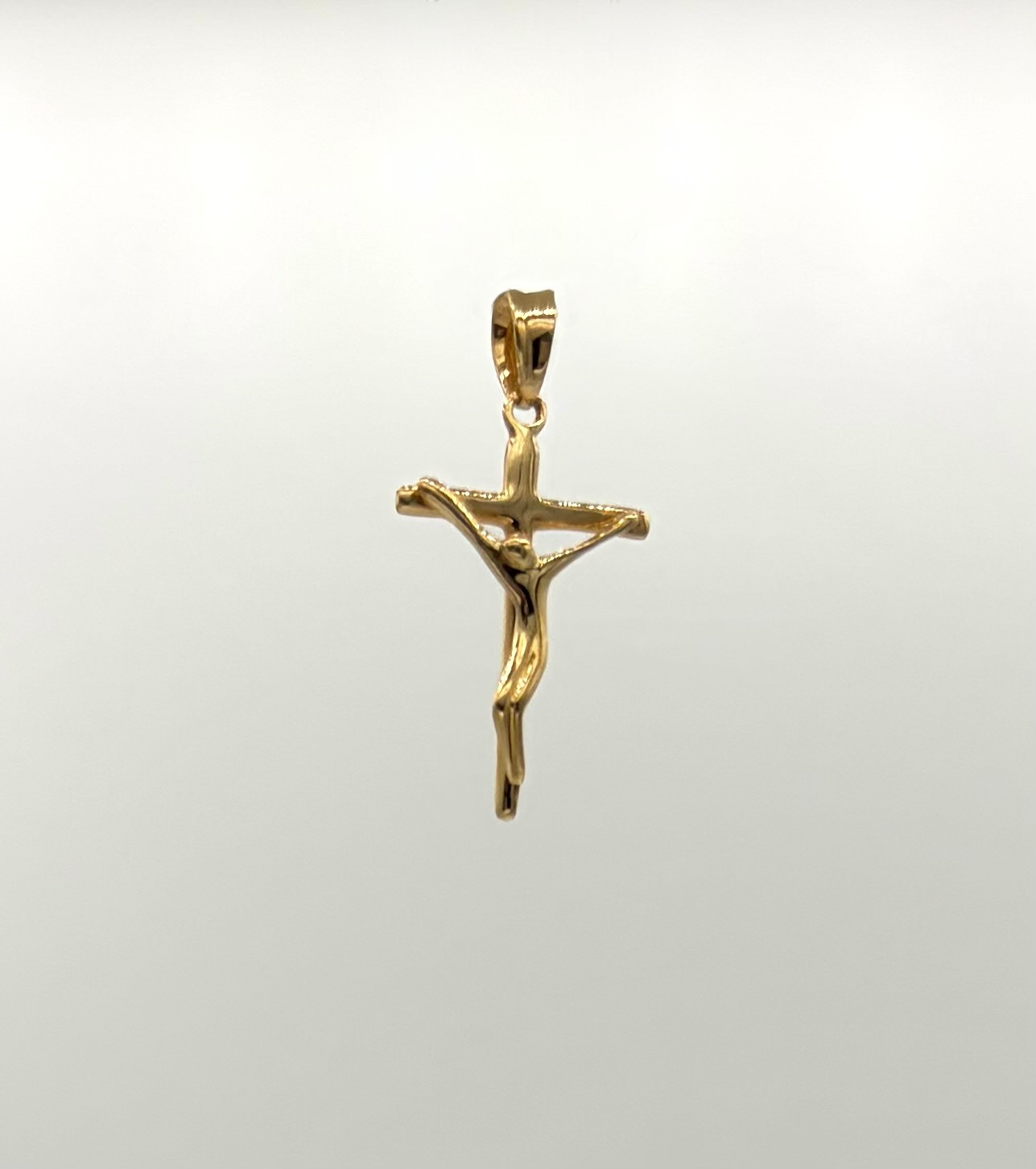 Dije cruz curva cristo Oro amarillo 18k 1,22 Gr / 3,0 Cm