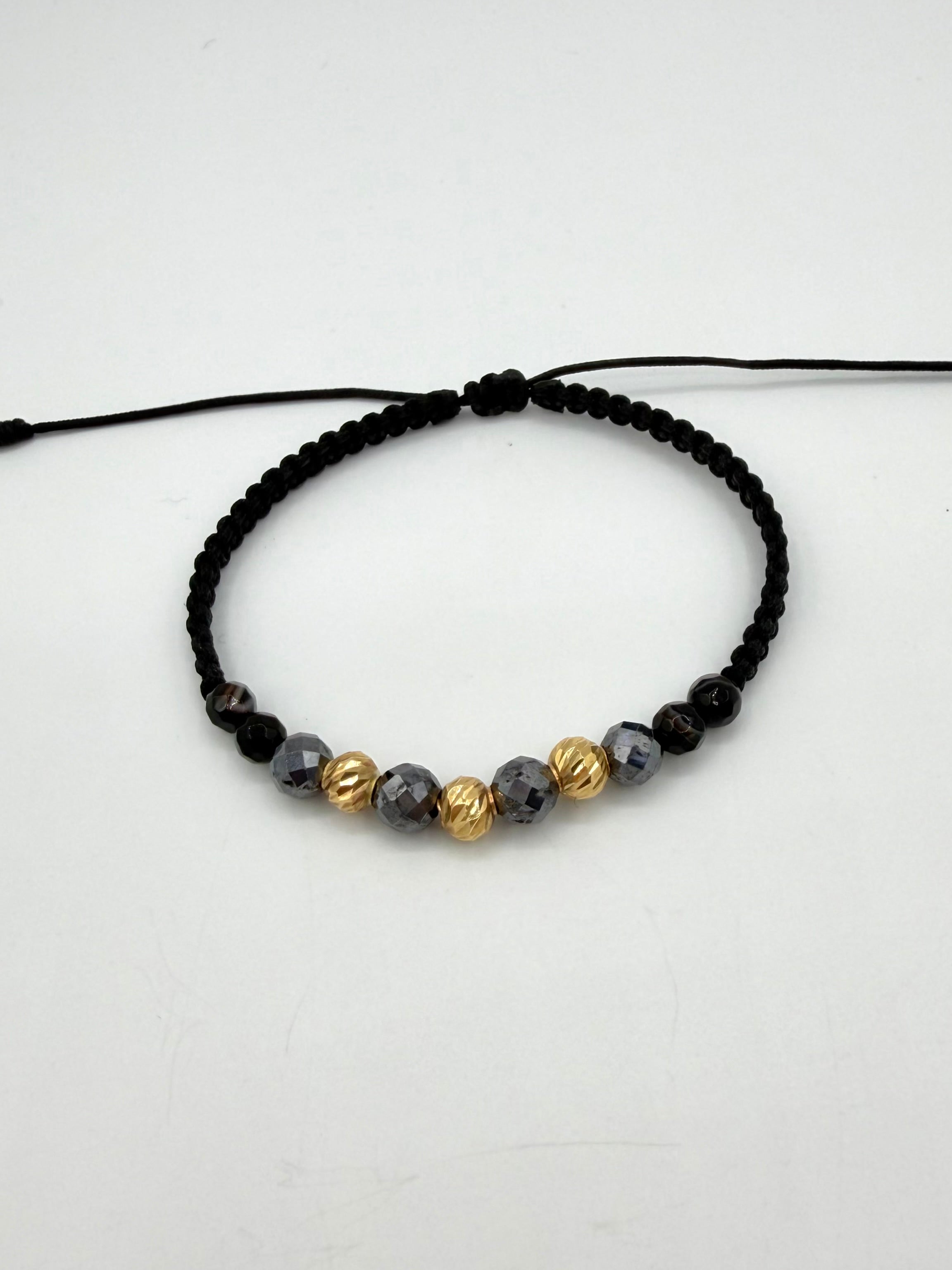 Pulsera tejida 3BD #5 piedras negras hilo negro Oro amarillo 18k 0,43 Gr