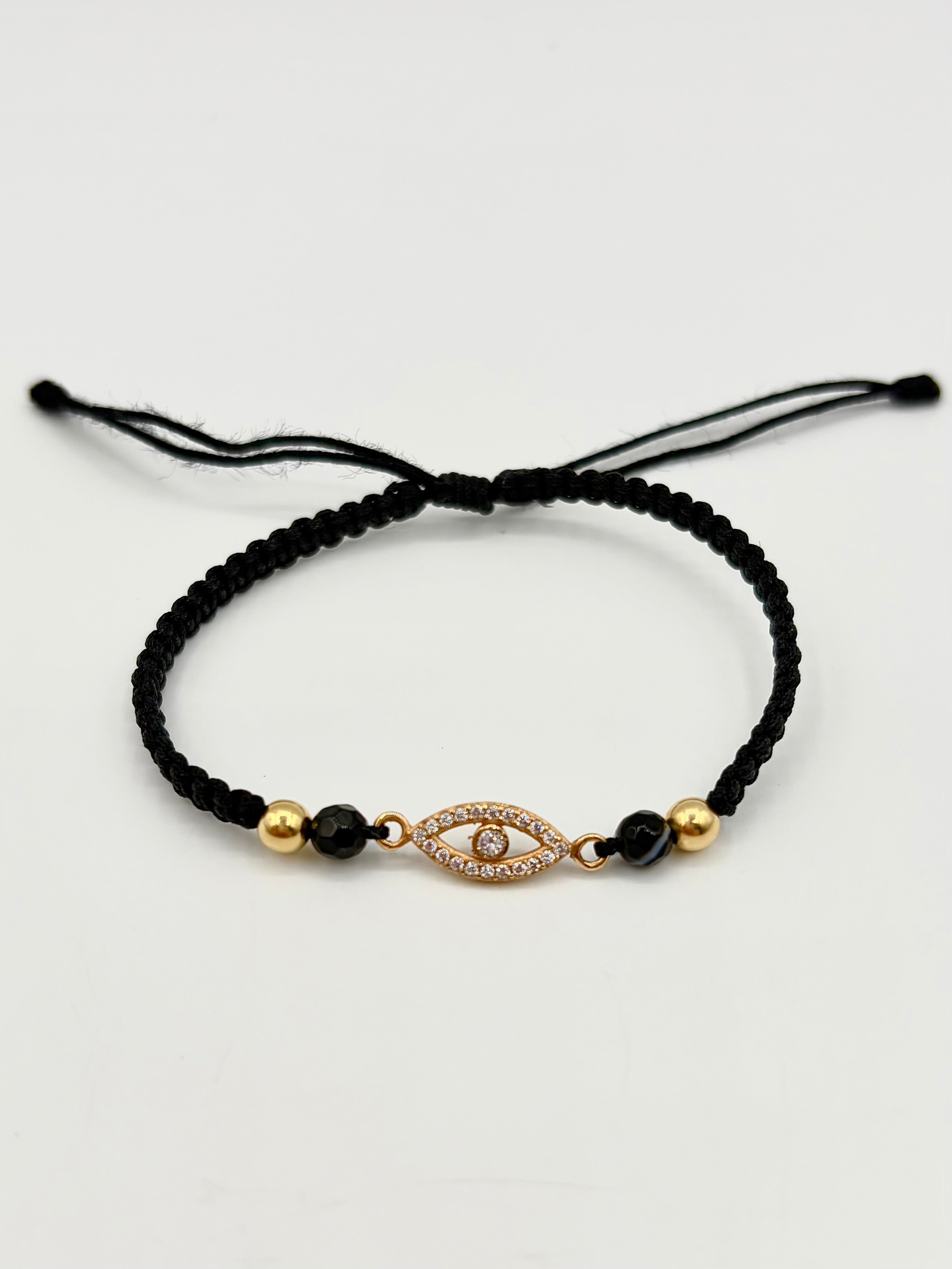 Pulsera tejida herraje ojo circones blancos 2BL #4 hilo negro Oro amarillo 18k 0,80 Gr