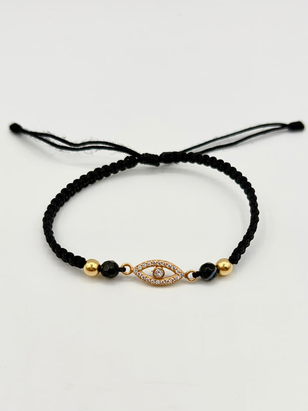Pulsera tejida herraje ojo circones blancos 2BL #4 hilo negro Oro amarillo 18k 0,80 Gr