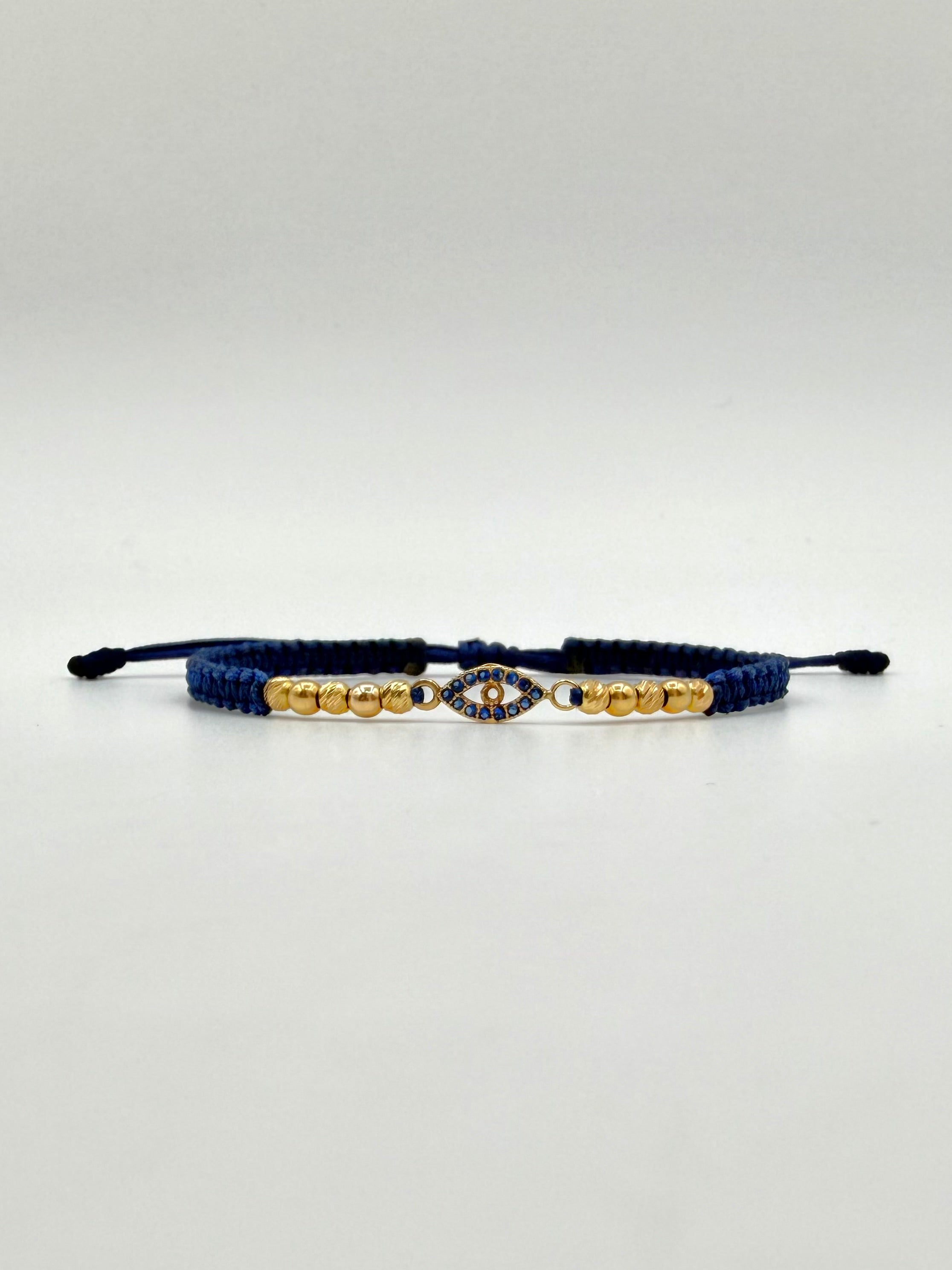 Pulsera tejida herraje ojo circones azules 6BD #3 4BL #3 hilo azul Oro amarillo 18k 1,60 Gr