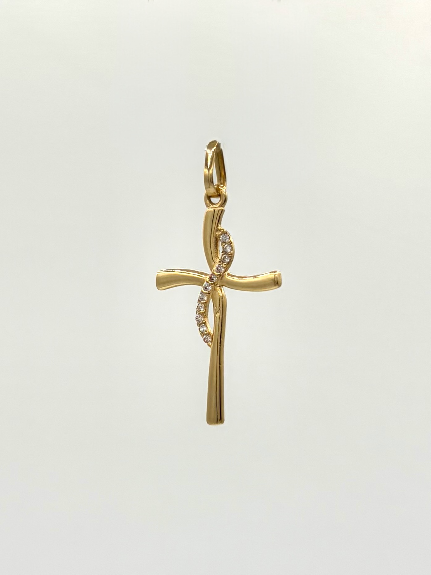 Dije cruz curva circones blancos Oro amarillo 18k 0,94 Gr / 2,5 Cm