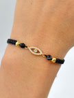 Pulsera tejida herraje ojo circones blancos 2BL #4 hilo negro Oro amarillo 18k 0,80 Gr