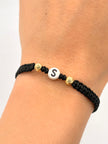 Pulsera tejida letra S 2BD #5 hilo negro Oro amarillo 18k 0,15 Gr