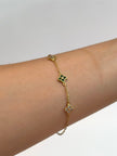 Pulso aro seguido trebol con circones verdes y blancos Oro amarillo 18k 2,30 Gr / 1,5 mm / 18,5 Cm Broche 0,15