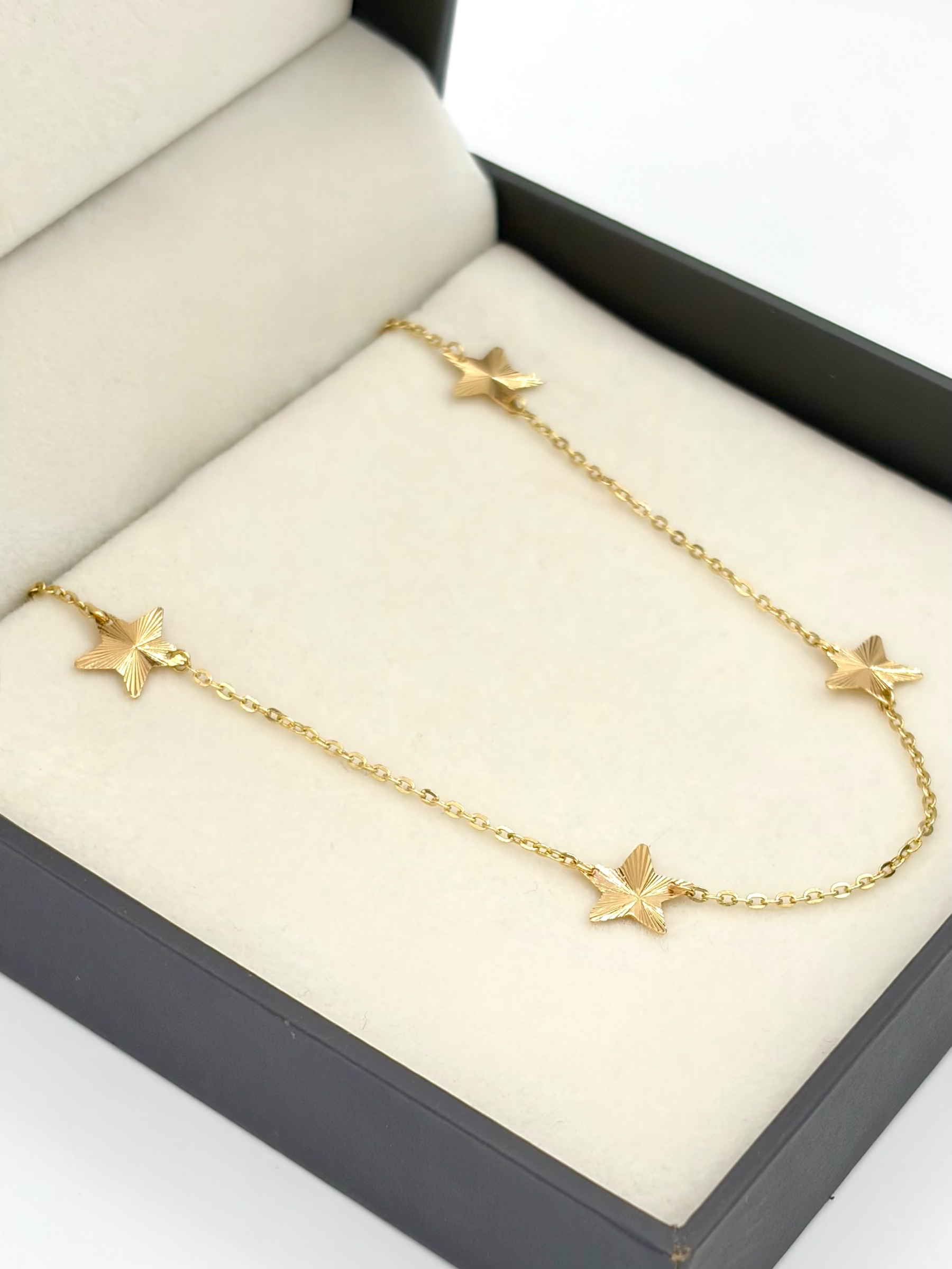 Tobillera aro seguido con dije estrella diamantado Oro amarillo 18k 1,73 Gr / 1,1 mm / 25,2 Cm Broche 0,15