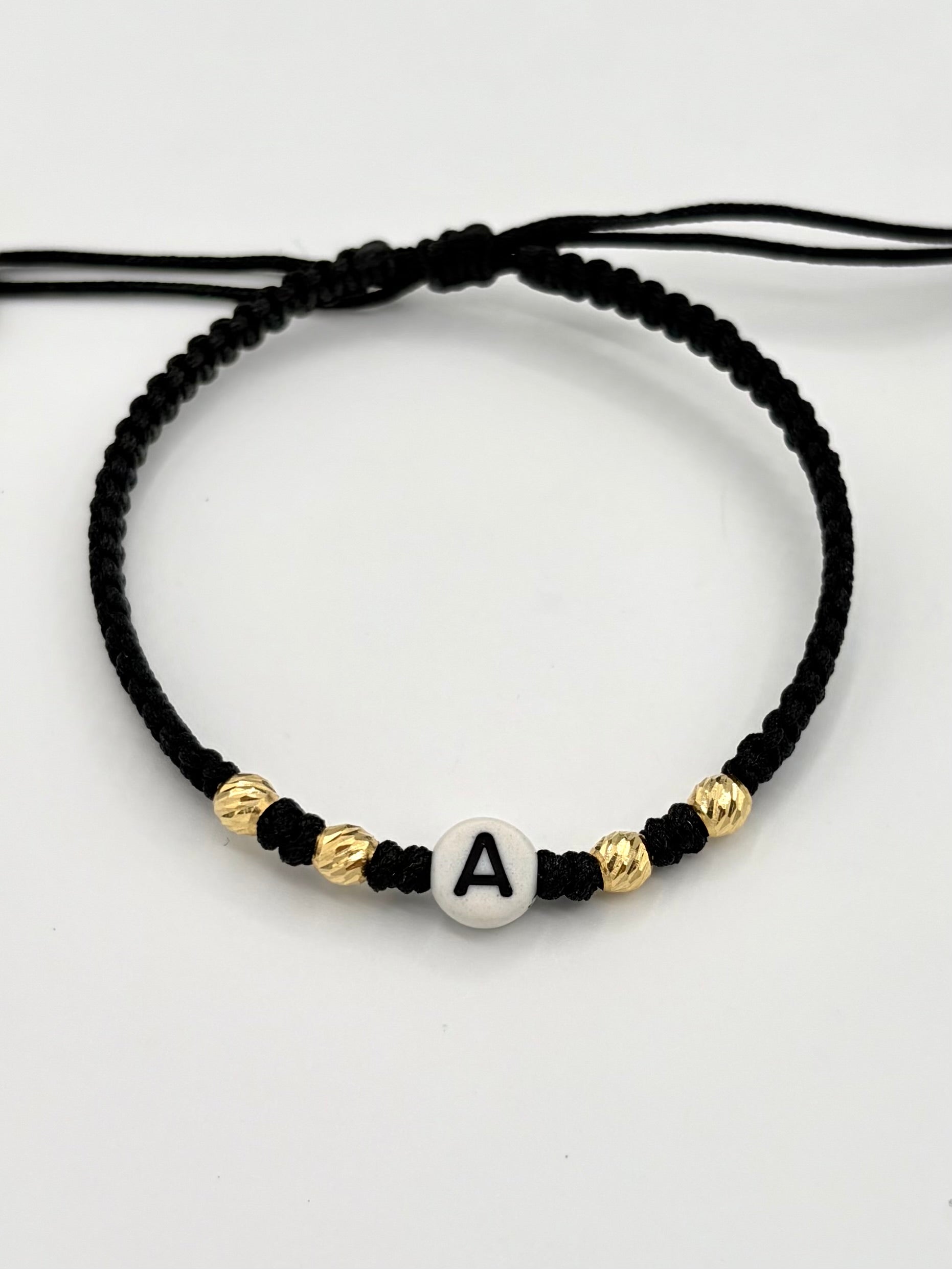 Pulsera tejida letra A 4BD #4 hilo negro Oro amarillo 18k 0,28 Gr