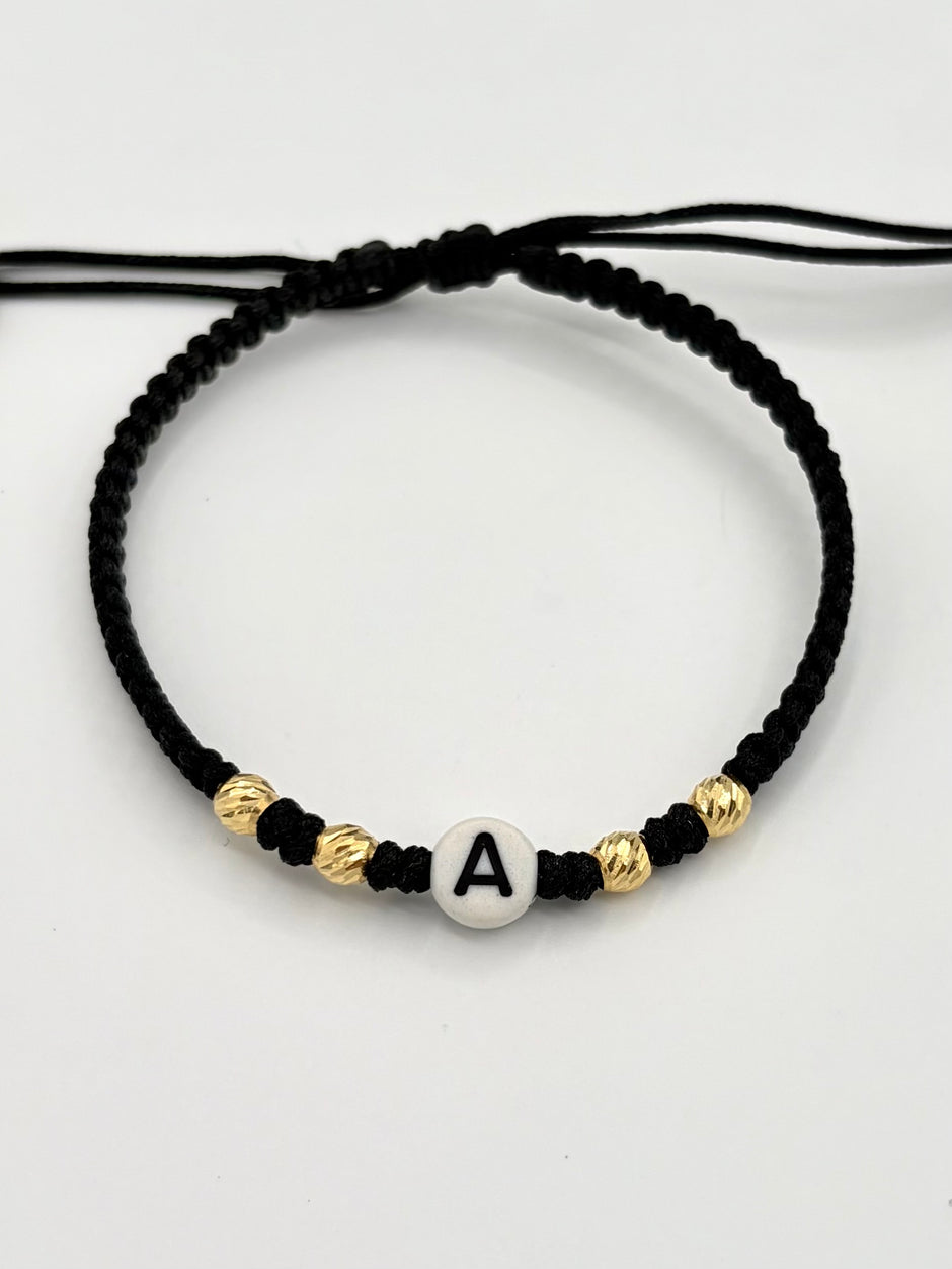 Pulsera tejida letra A 4BD #4 hilo negro Oro amarillo 18k 0,28 Gr