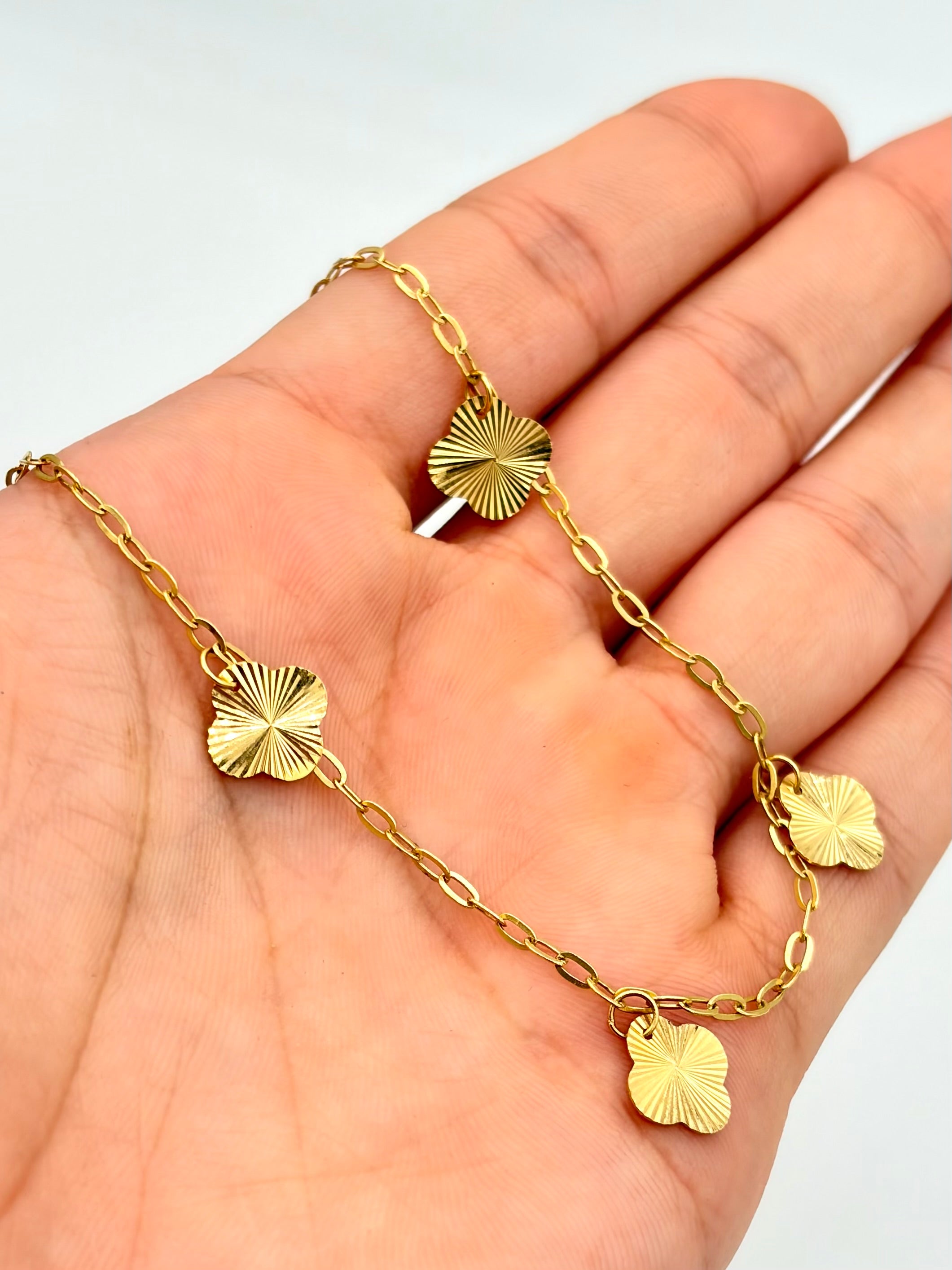 Tobillera aro seguido con dijes trebol diamantado Oro amarillo 18k 2,50 Gr / 2,0 mm / 25 Cm Broche 0,15
