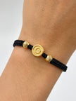 Pulsera tejida herraje O 2BD #6 hilo negro Oro amarillo 18k 0,71 Gr
